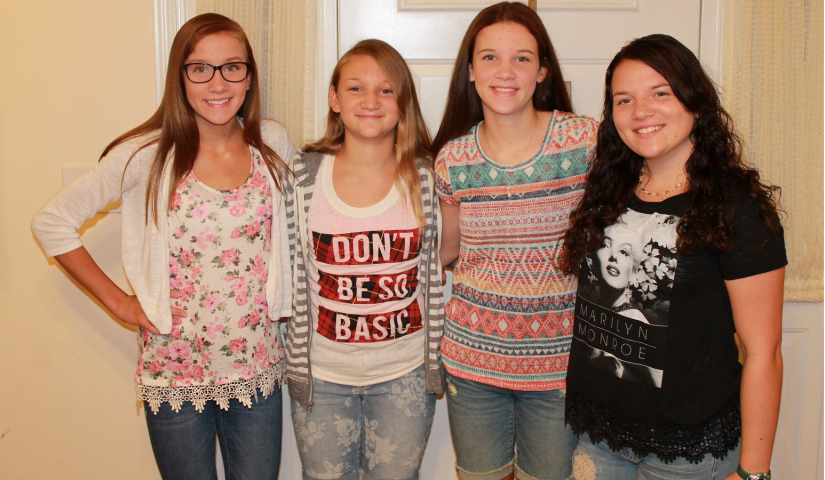 TrialNet participant Hollie Shereyk poses with her 3 sisters standing in front of a doorway